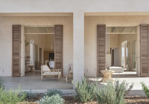 Warm minimalist Mediterranean-style villa with pool