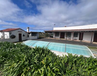 Rustic-style house with a swimming pool, mountain and sea views
